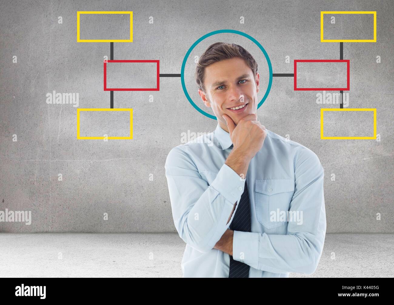 Digital composite der Geschäftsmann und bunte Mind Map über grauer Hintergrund Stockfoto