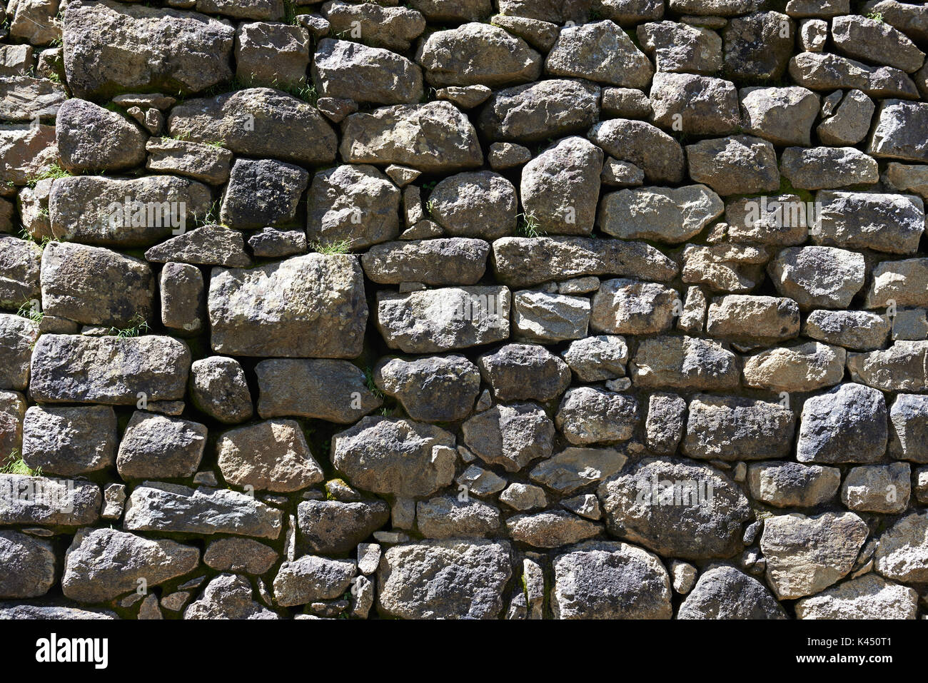 Naturstein alter Ziegel Wand Hintergrund. Rauer stein Wand Stockfoto