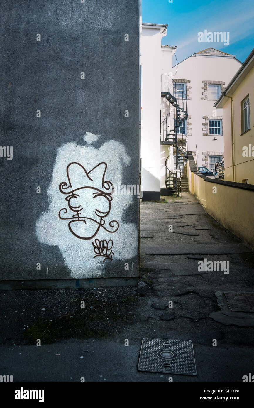 Graffiti - Graffiti an einer Wand in der Nähe von Truro, Cornwall gesprüht. Stockfoto