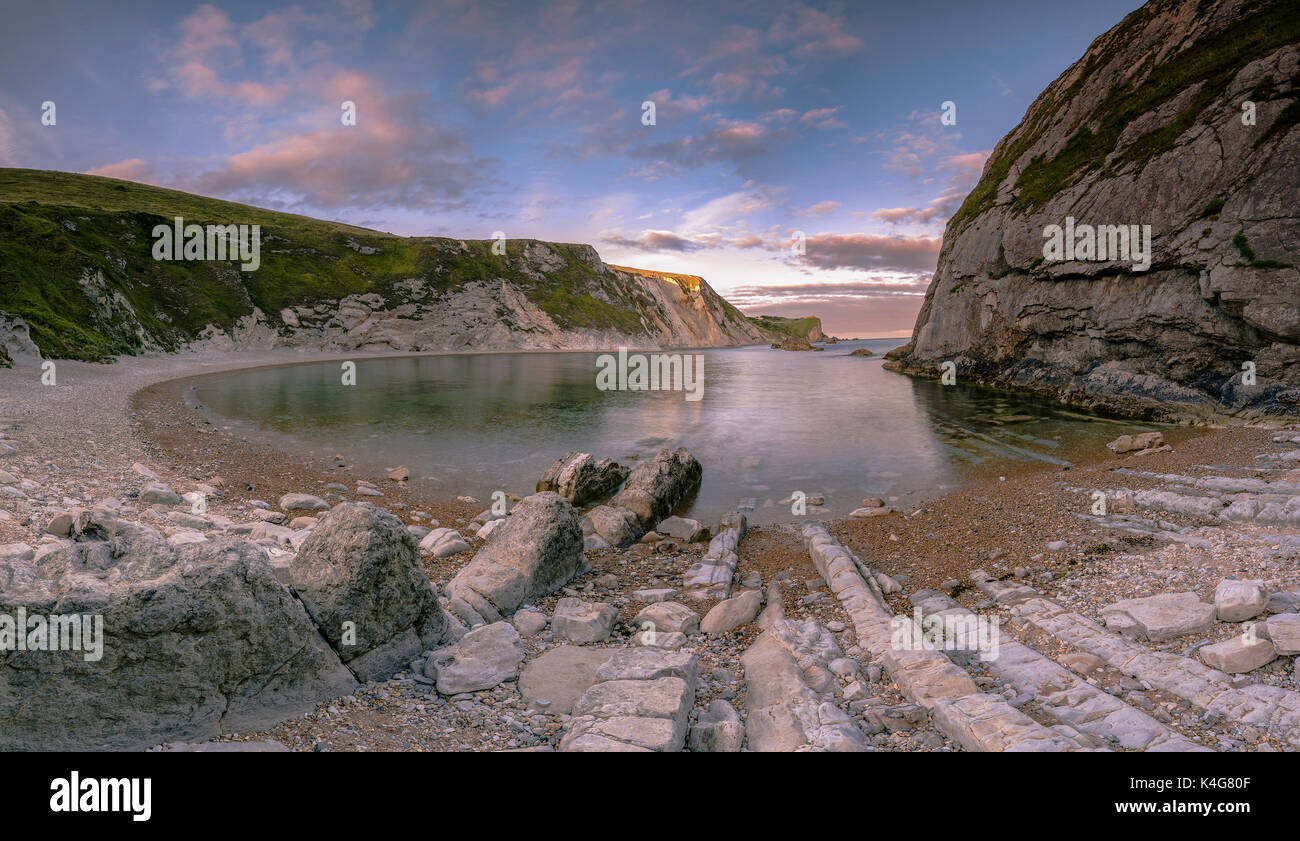 Sonnenuntergang am Mann des Krieges Bay, Lulworth in Dorset England UK Stockfoto