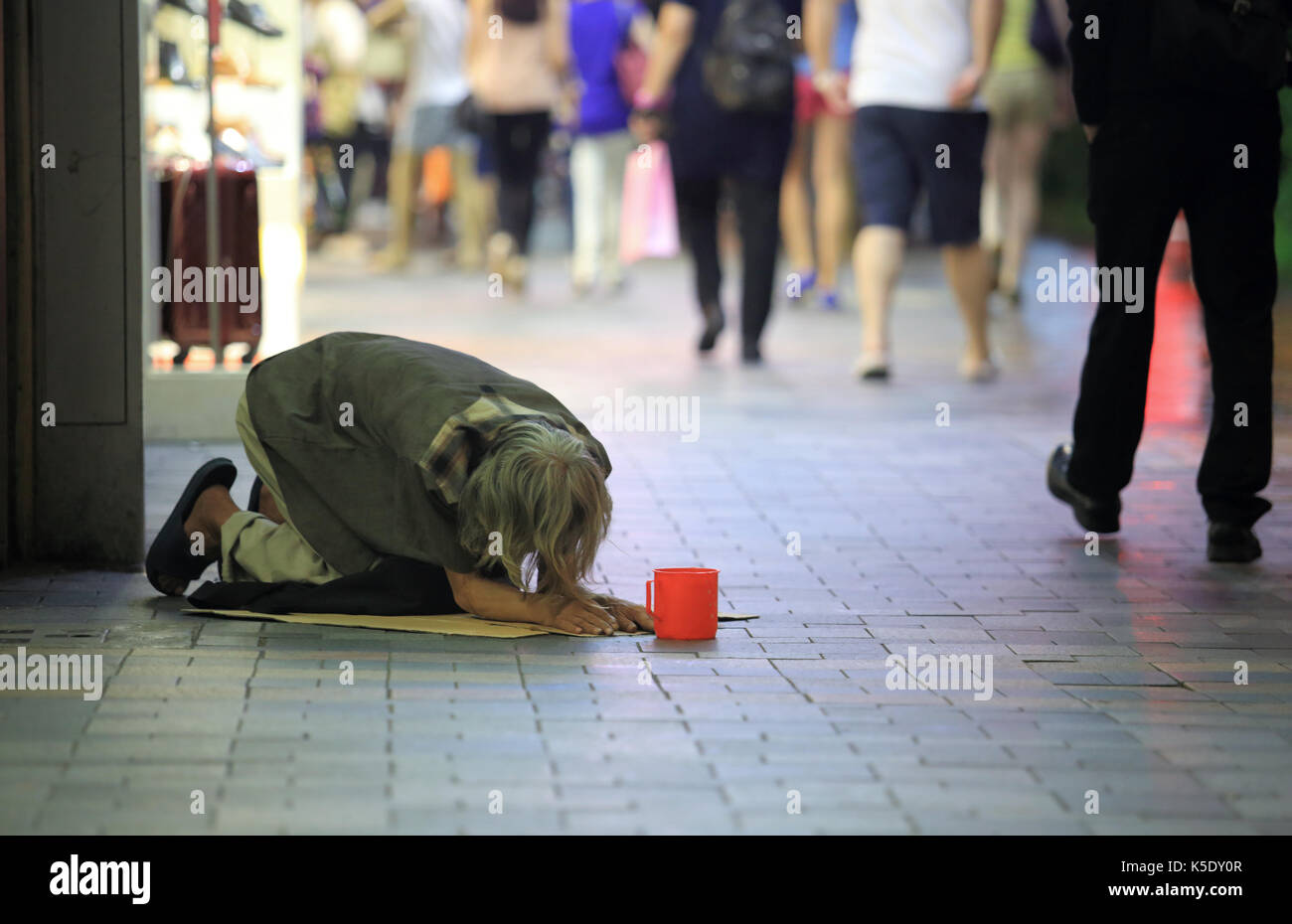Bettler in Hong Kong Stockfoto