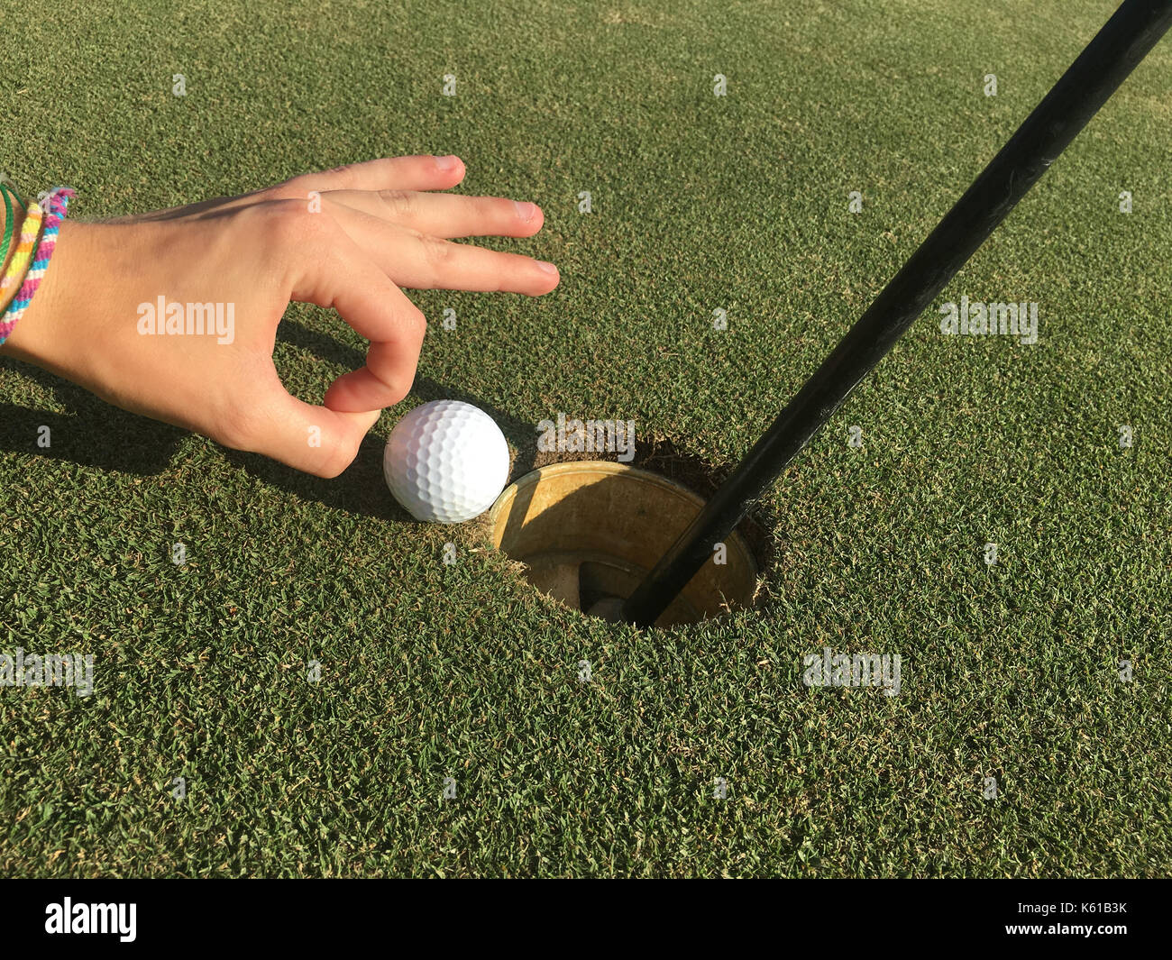 Die Golf Ball ein sanfter Überzeugungskraft Stockfoto