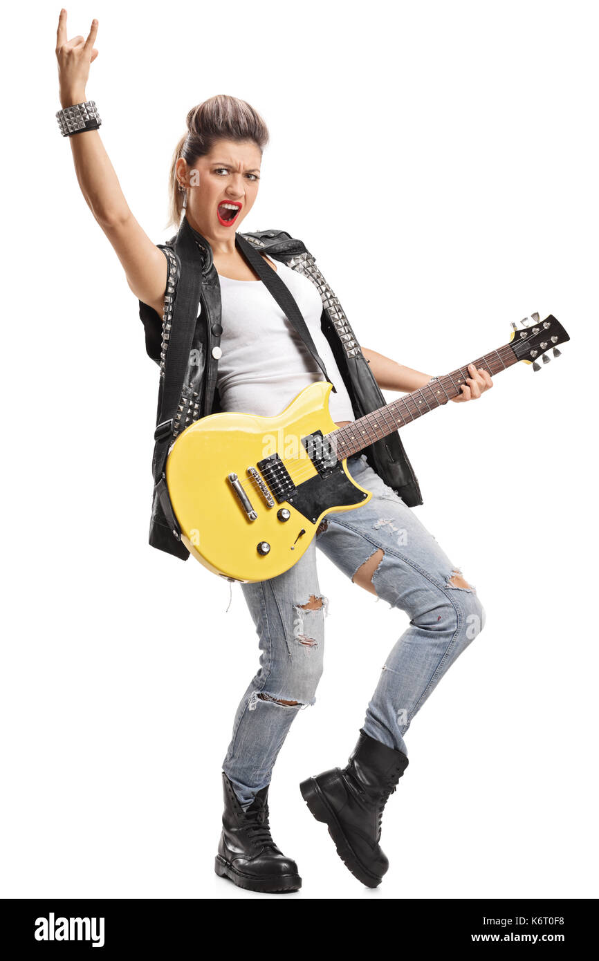 In voller Länge Porträt einer Punk Girl mit einer E-Gitarre, eine rock Geste auf weißem Hintergrund Stockfoto