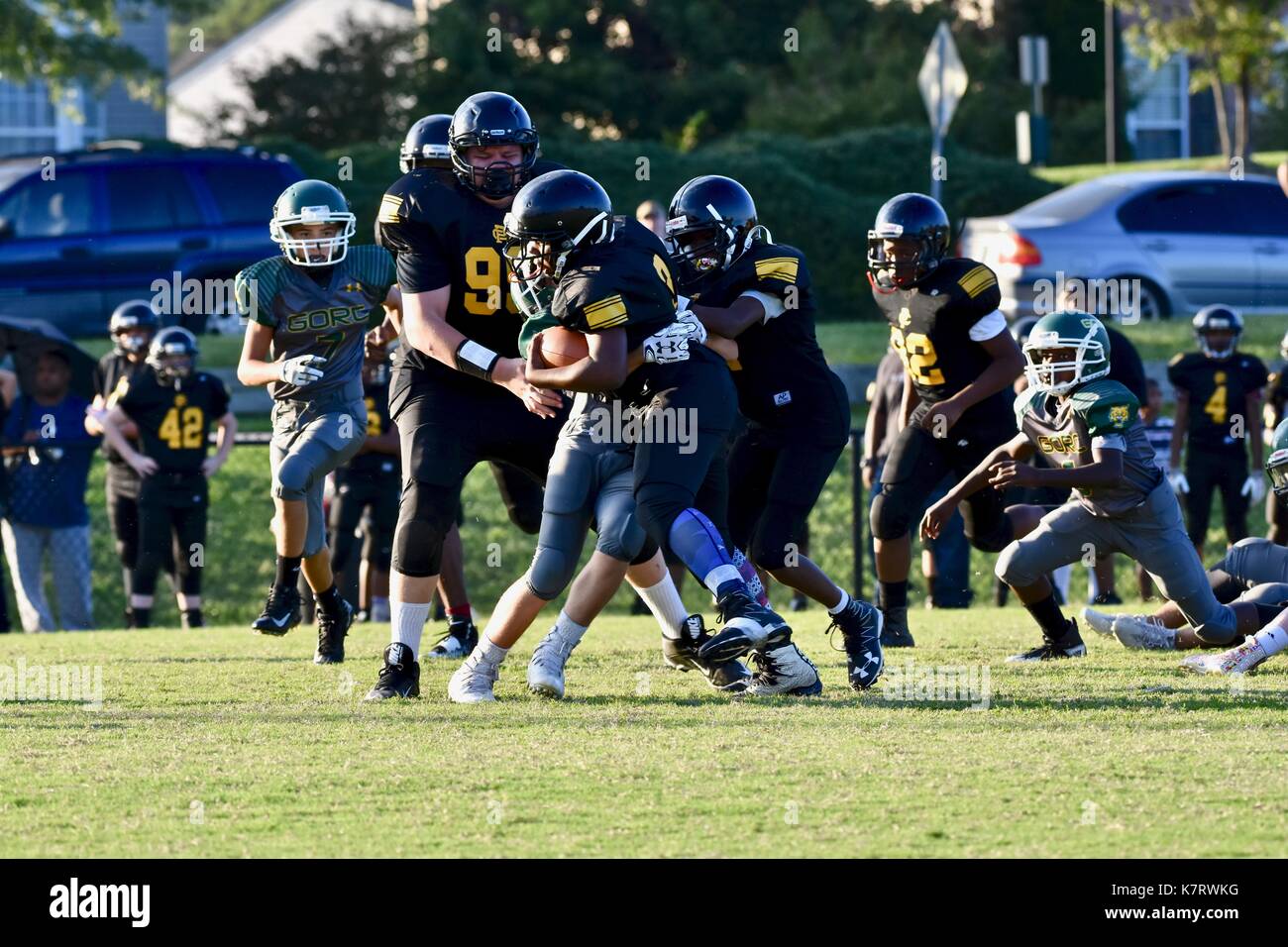 American Football zurück läuft, halten Sie den Griff Stockfoto