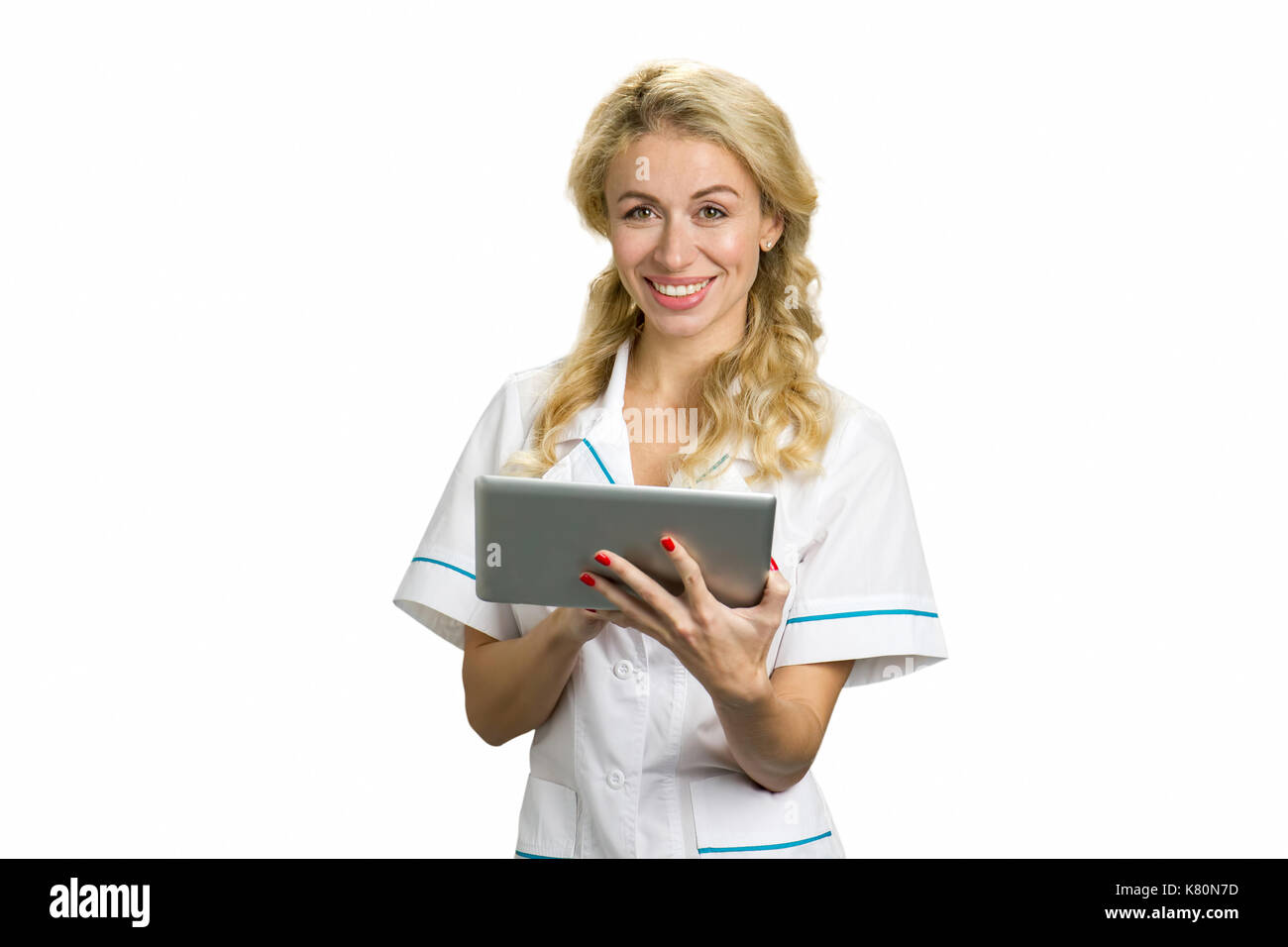 Glückliche junge Krankenschwester mit computer Tablet. Stockfoto