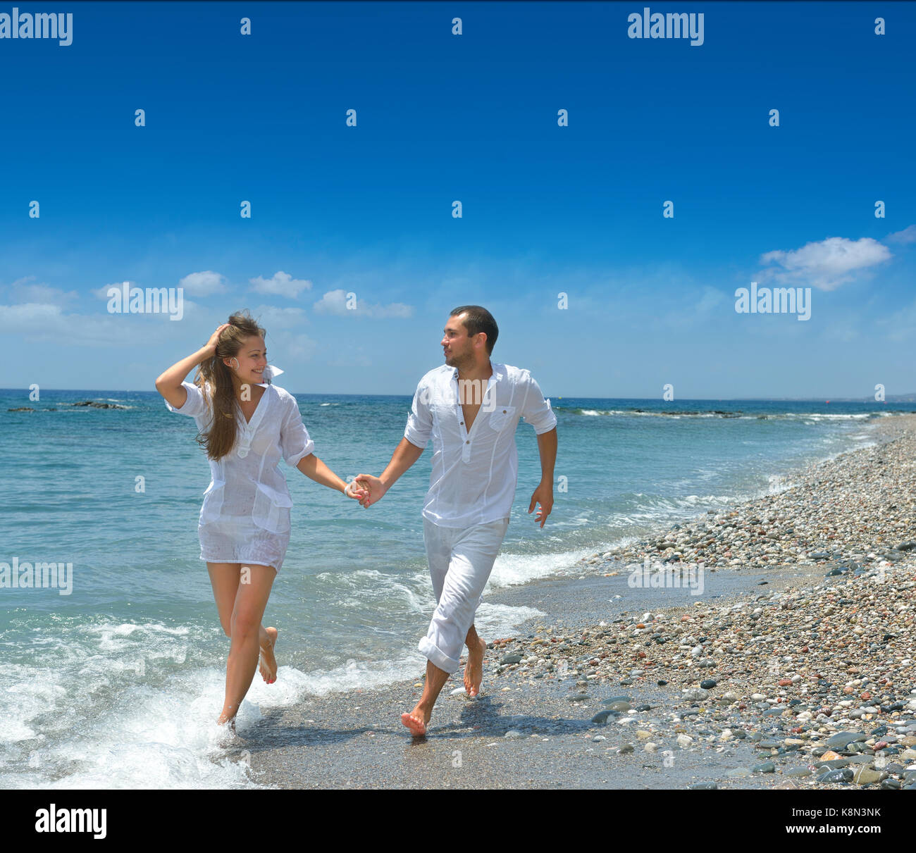 Am Strand, mit Mann und Frau Stockfoto