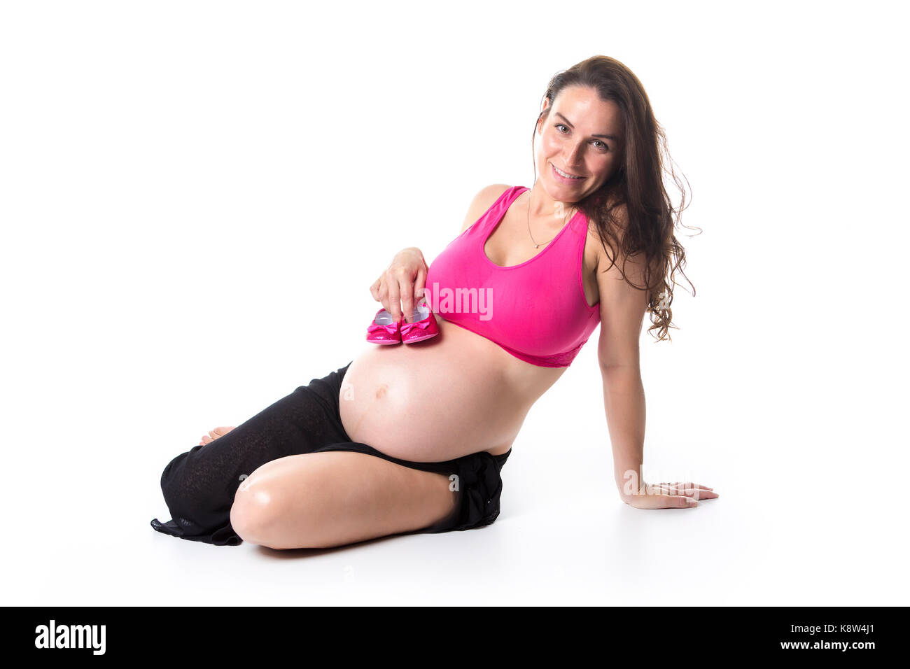 Schwangere Frau Bauch auf weißem Hintergrund Stockfoto