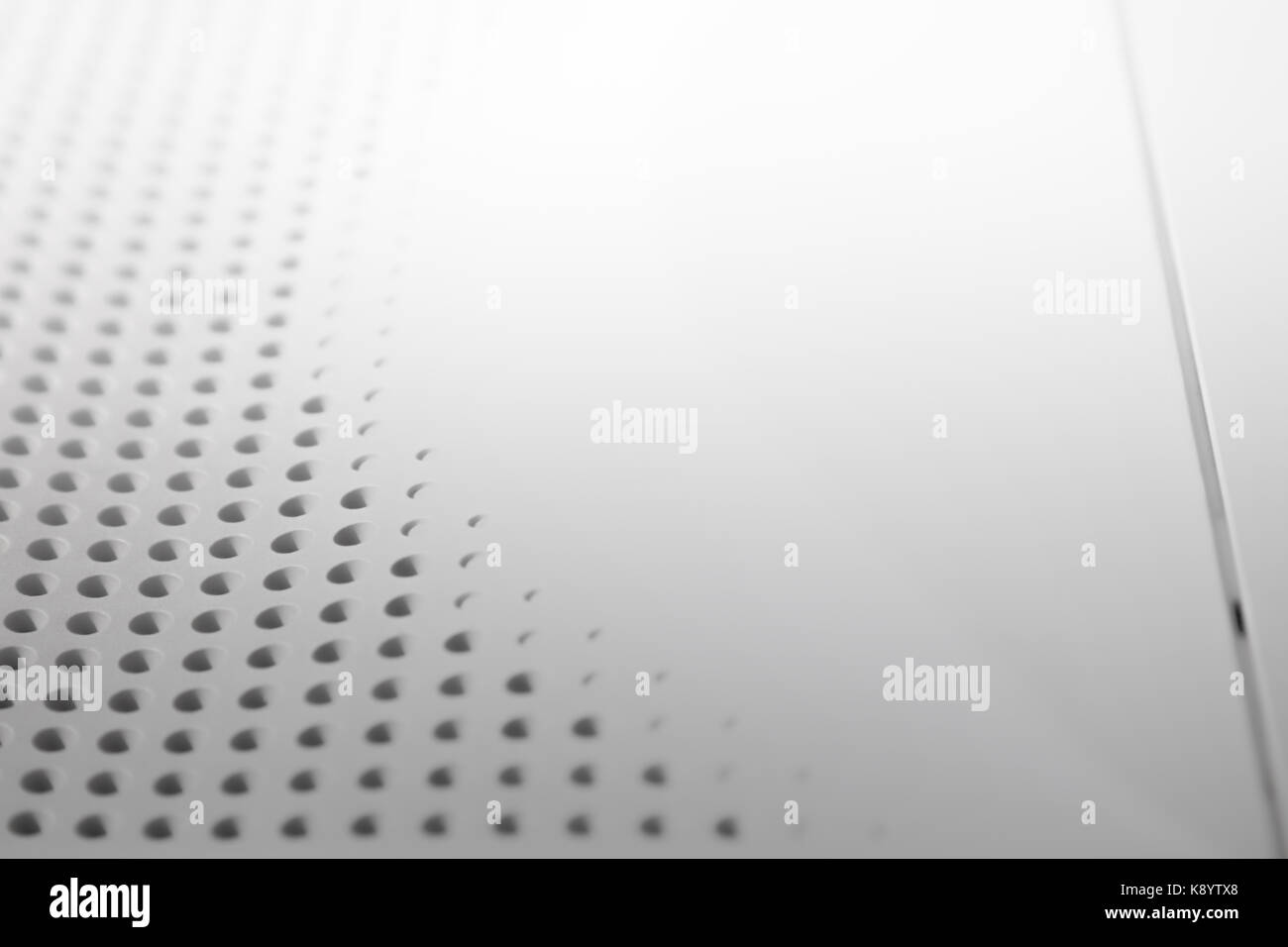Abstrakte Licht farbige Oberfläche mit Bohrungen in einer Reihe für Kreativität gebaut, Wallpaper und Hintergründe. Stockfoto
