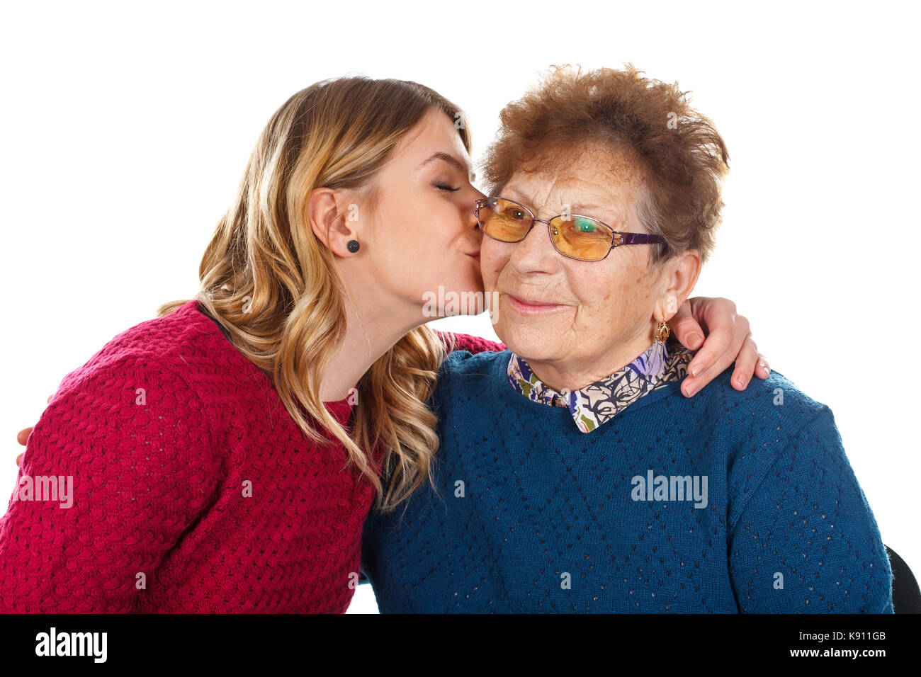 Bild einer Art Frau küssen eine alte Dame - isoliert Hintergrund Stockfoto