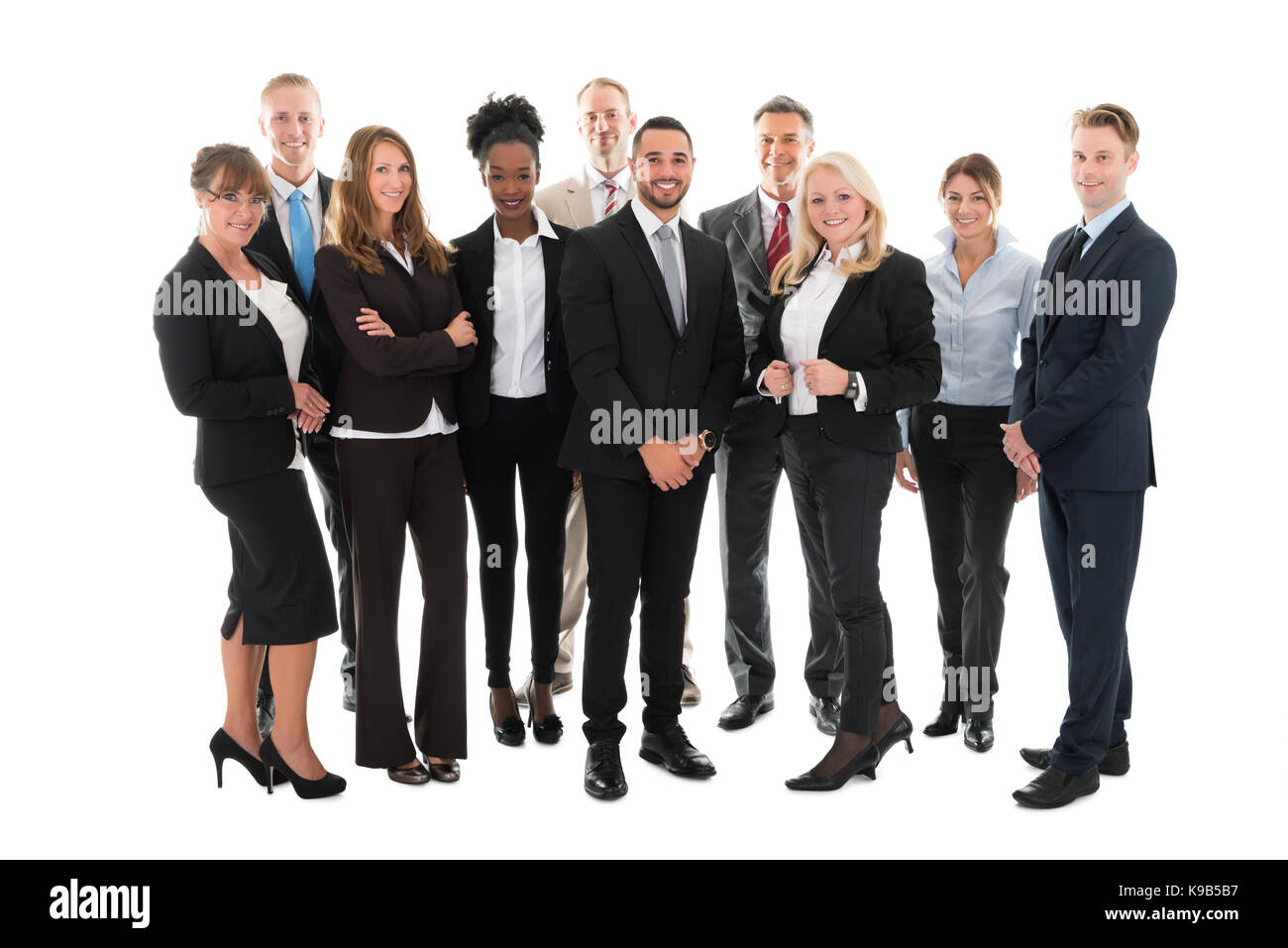 In voller Länge Portrait von zuversichtlich Business Team stehen auf weißen Hintergrund Stockfoto