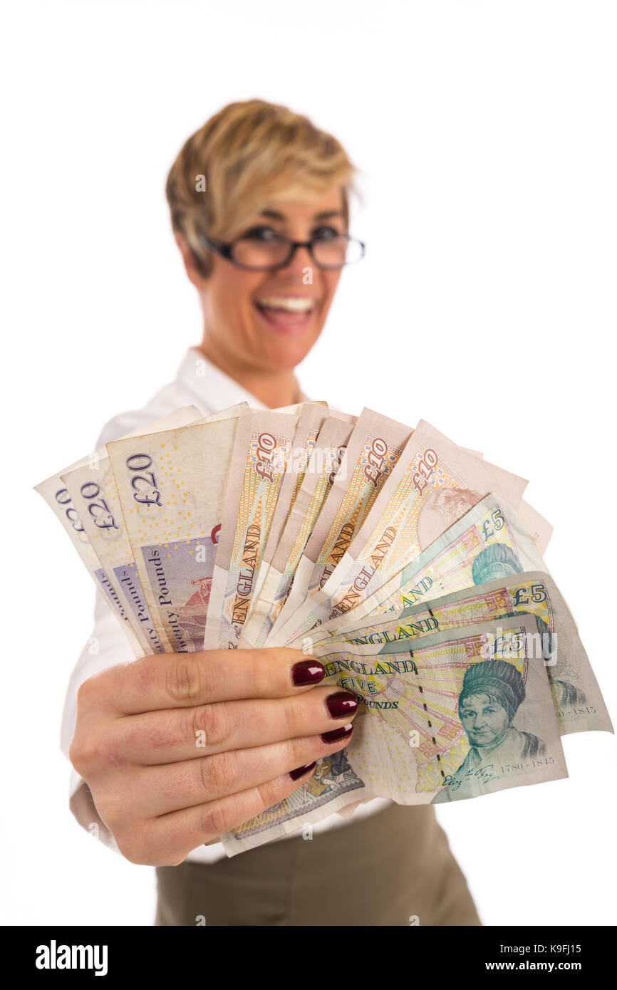Eine erfolgreiche Geschäftsfrau mit einer Handvoll cash Stockfoto