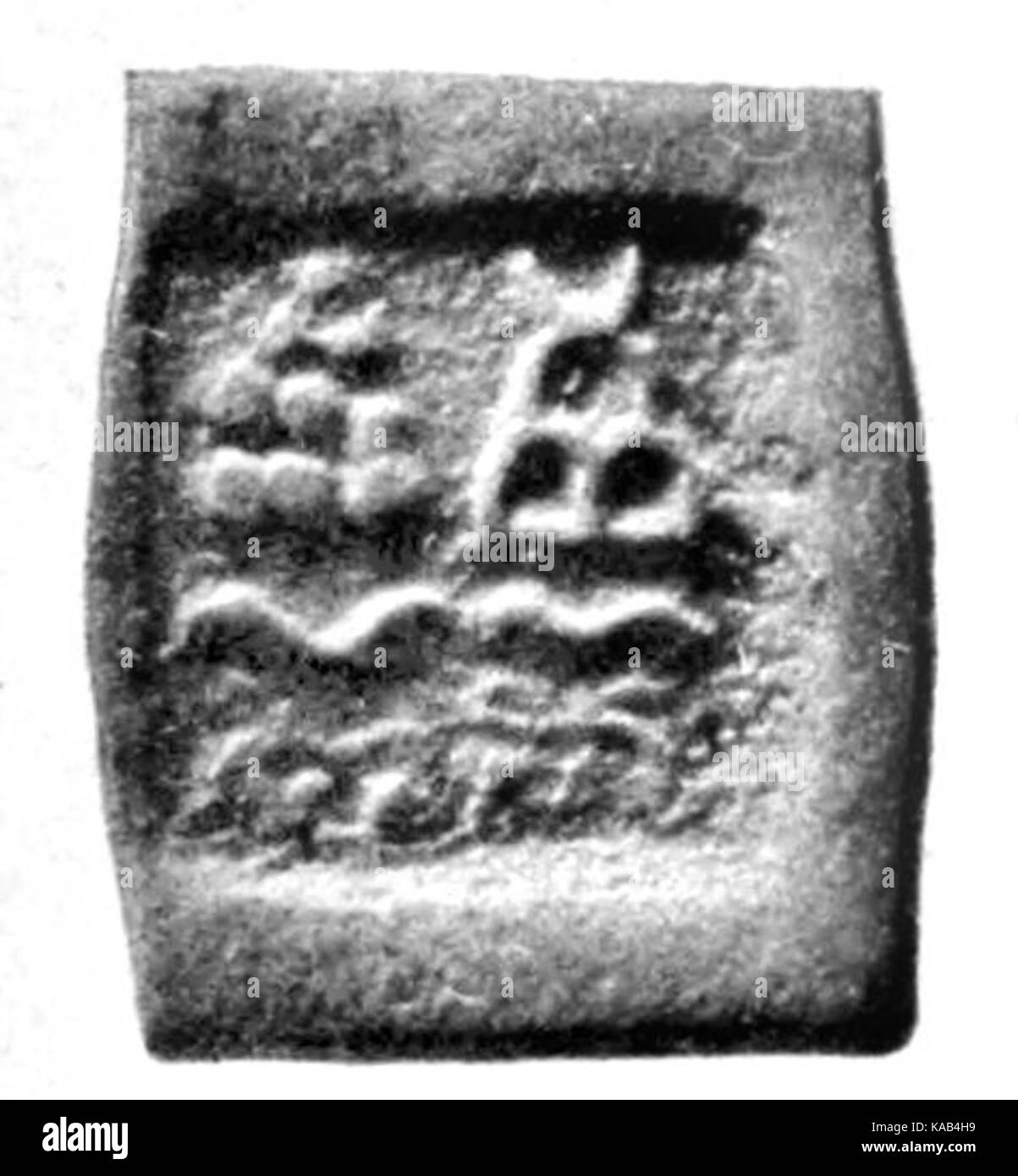 Eine einzige Münze aus Taxila, einer antiken Stadt im heutigen Pakistan, die für ihre reiche Geschichte und archäologische Bedeutung bekannt ist. Diese Münze stammt wahrscheinlich aus der Zeit des indogriechischen oder Kushan-Reiches und zeigt die Rolle der Region im frühen Handel und in der Kultur. Stockfoto