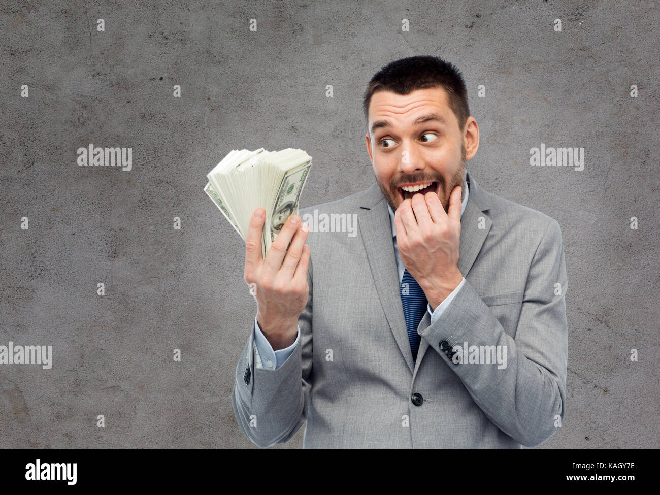 Gierig Geschäftsmann mit amerikanischen Dollar Geld Stockfoto