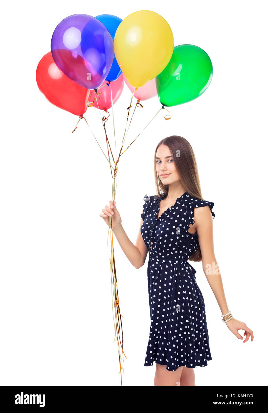 Porträt der schönen jungen Frau in Polka Dot dress mit bunten Luftballons auf weißem Hintergrund Stockfoto