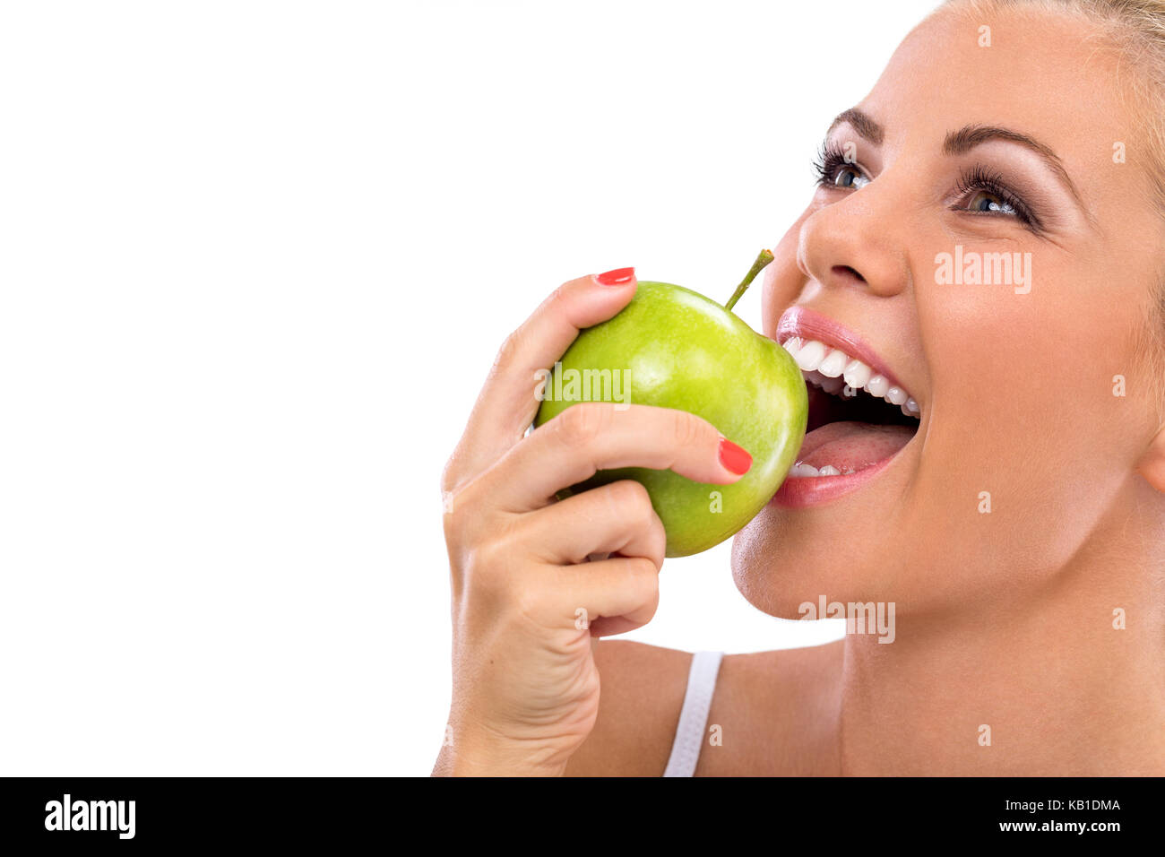 Frau essen, grüner Apfel, Beißen, Apfel mit perfekte Zähne Stockfoto