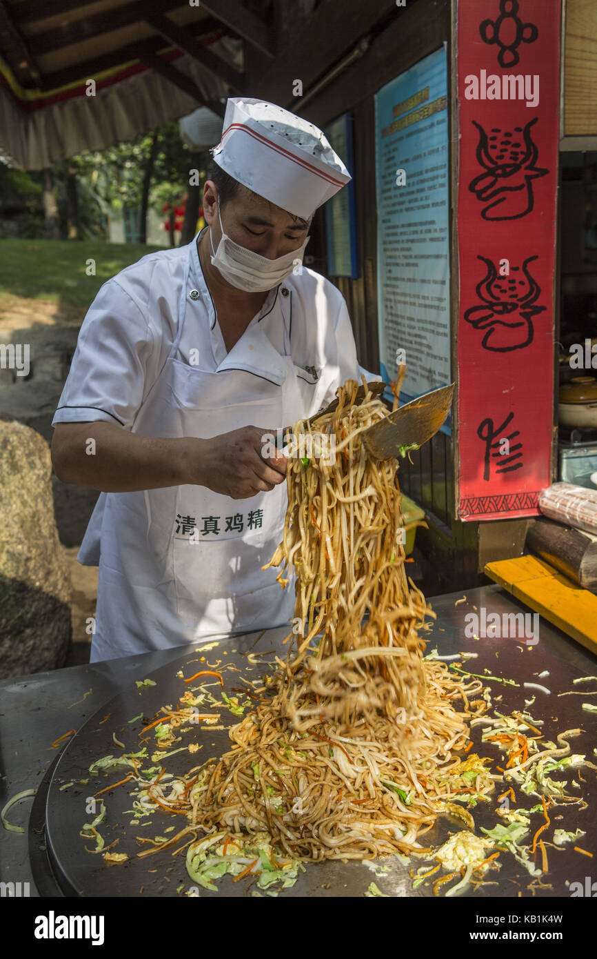 Person bereitet Essen, Splendid China Park, shenzhin, Stockfoto