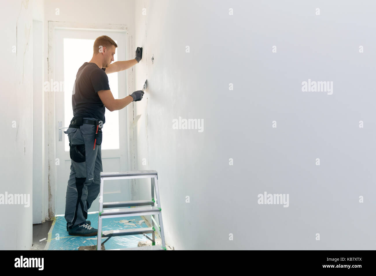 Home Innenausbau - Arbeitnehmer Instandsetzung Wand Stockfoto