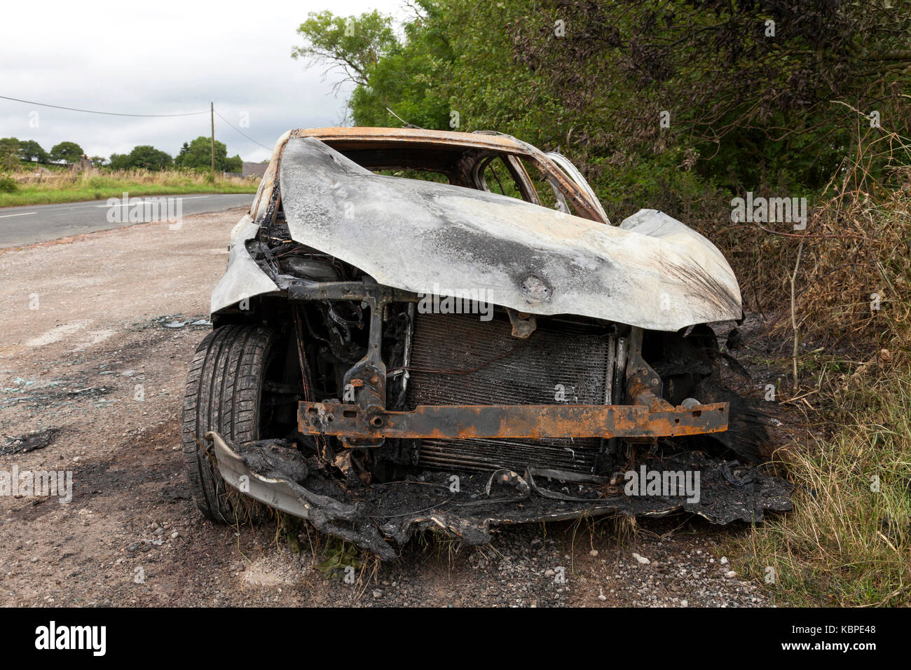 Ein BMW in einer lag in Großbritannien verbrannt Stockfoto