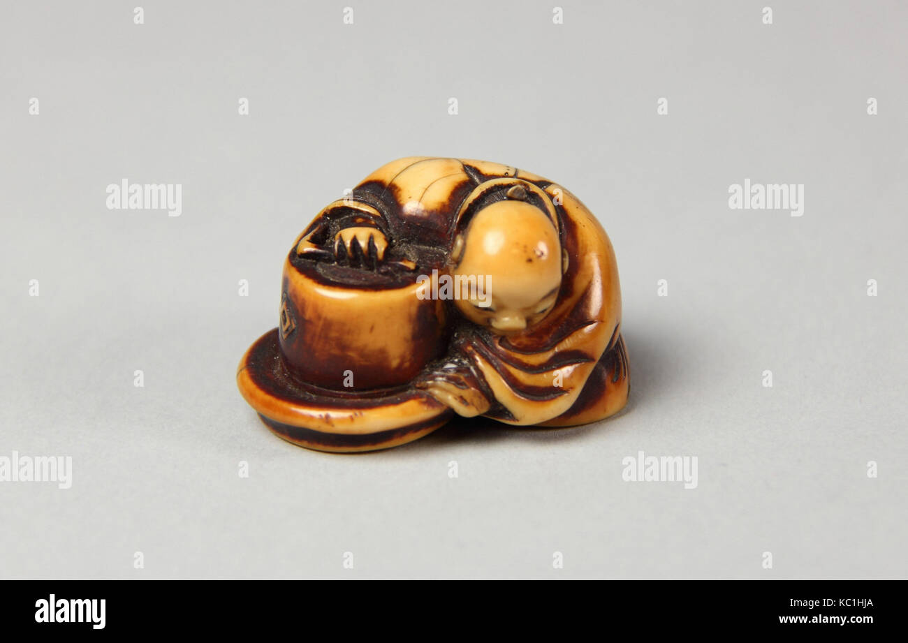 Netsuke der Kaufmann, Mitte des 19. Jahrhunderts, Japan, Elfenbein, H.1. (2,5 cm); L.1 1/4 in. (3.2 cm), Netsuke Stockfoto