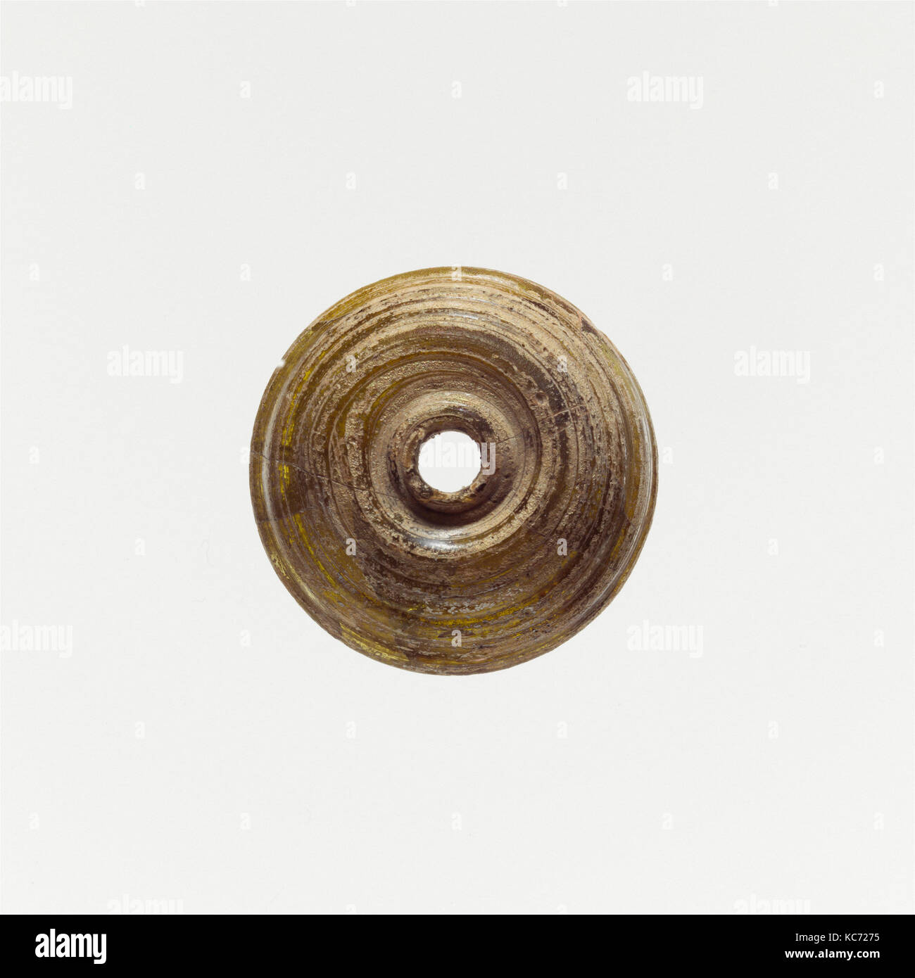 Glas Spindel Wirtel, Imperial, Ca. 1 St - 2. Jh. N.CHR., Römische, Glas; rod-gebildet und Wunde, H.: 3/8 in. (0,9 cm), Glas Stockfoto