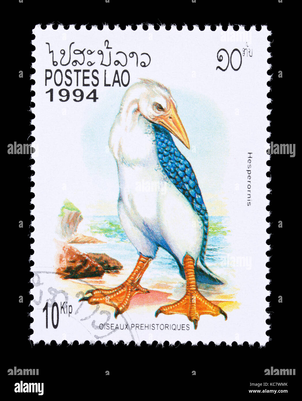 Briefmarke aus Laos mit der Darstellung eines Hesperornis, große ausgestorben flugunfähige aquatische Vogel Stockfoto