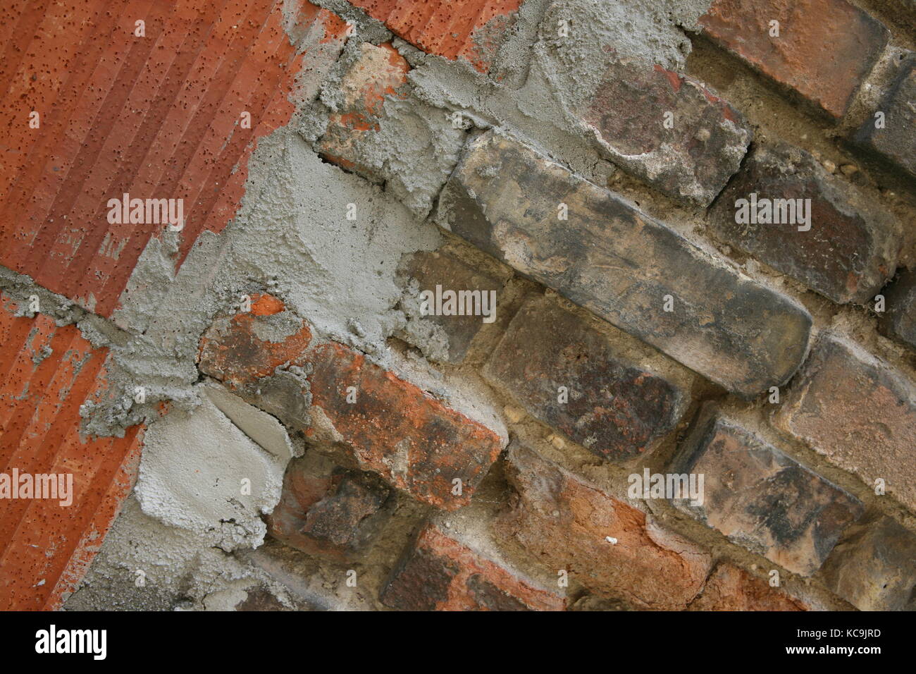 Mauer mit unterschiedlichen Steinen - Wand mit verschiedenen Steinen Stockfoto