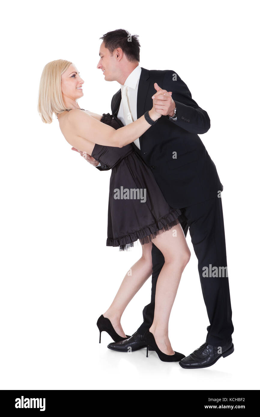 Paar gekleidet In formelle Kleidung tanzen isoliert auf weißem Hintergrund Stockfoto