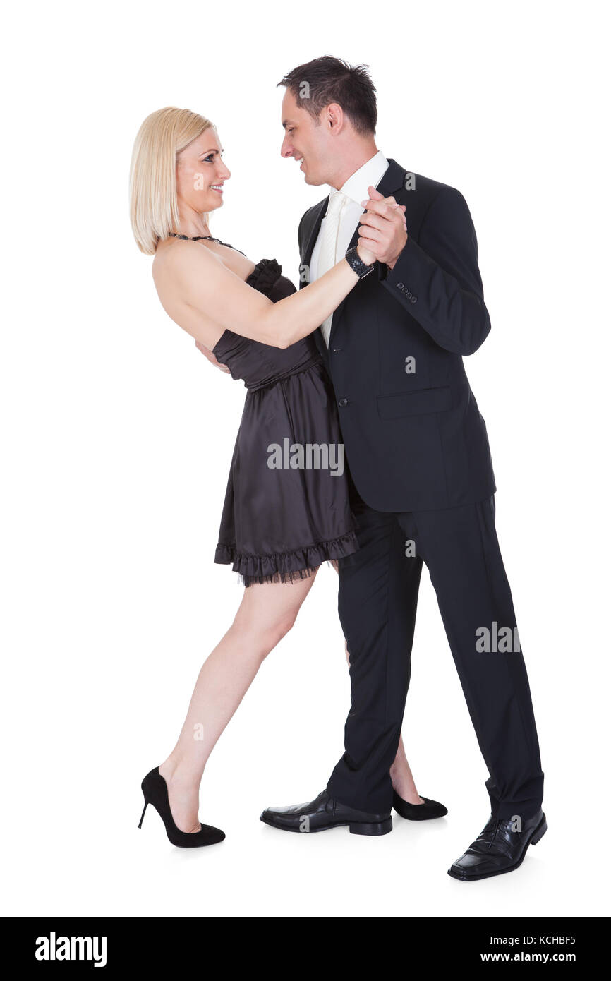 Paar gekleidet In formelle Kleidung tanzen isoliert auf weißem Hintergrund Stockfoto