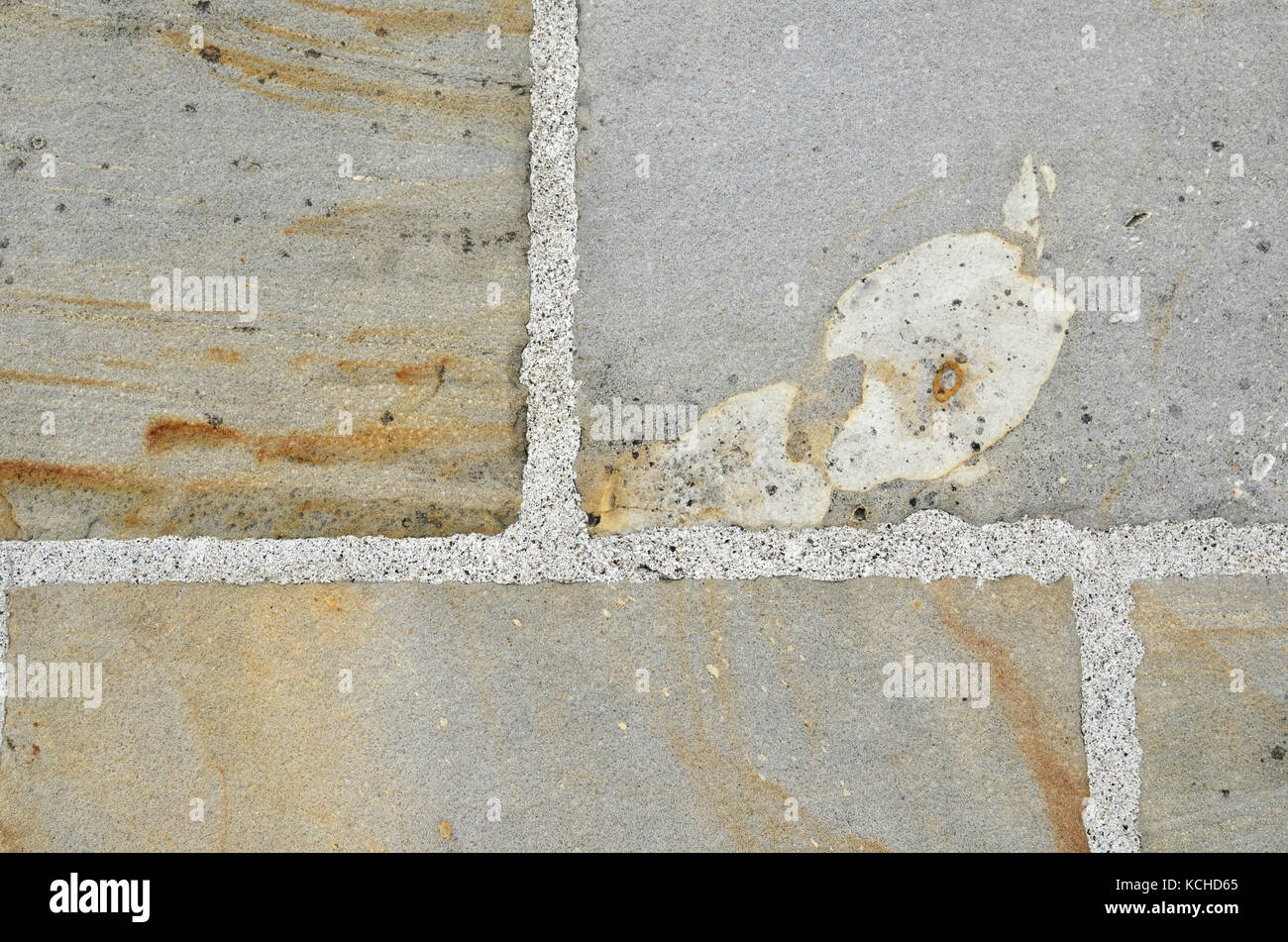 Grau und warme Farbe ashlars Oberfläche mit werkstein zwischen ihnen Stockfoto