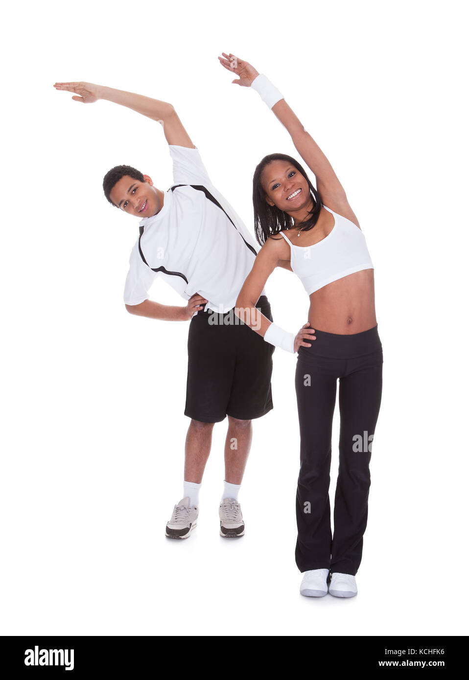Porträt des jungen Paares Ausübung Over White Background Stockfoto