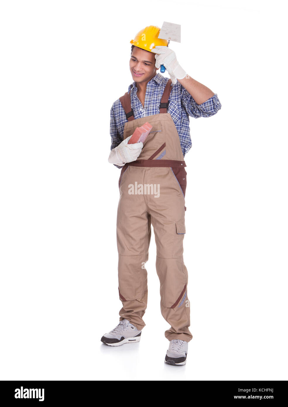 Porträt von lächelnden Maurer. Isoliert auf weiss Stockfoto
