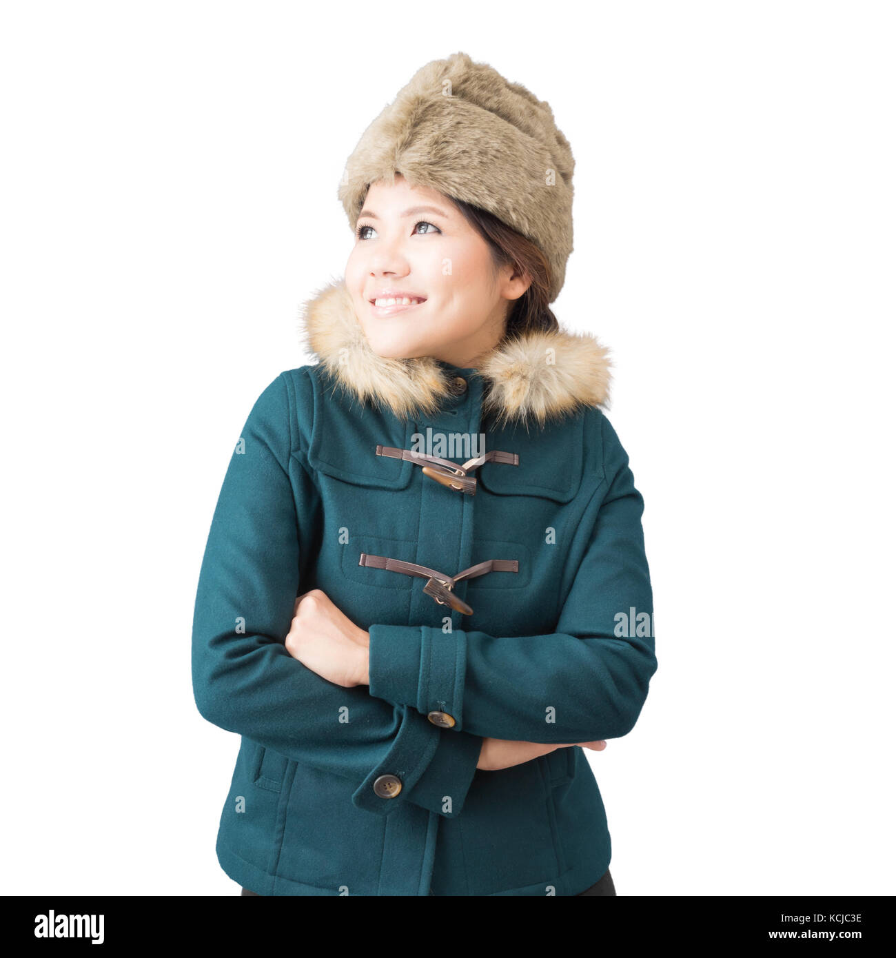 Asiatische Frau mit grünen Mantel mit Fell Hut isoliert auf weiss Stockfoto