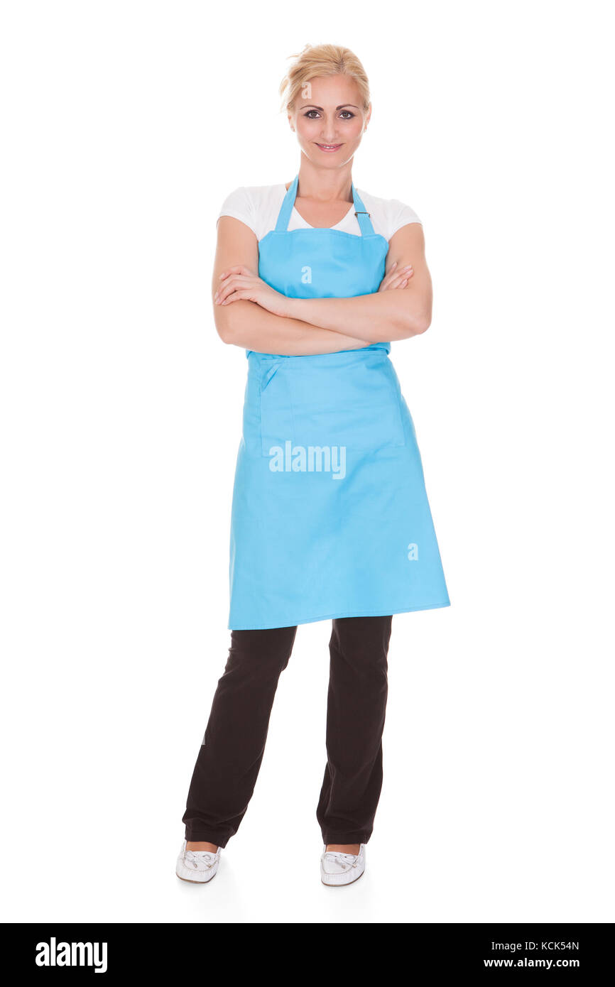 Glückliche Frau tragen Küche Schürze auf weißem Hintergrund Stockfoto