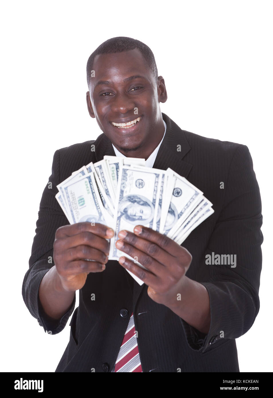 Portrait der junge Geschäftsmann holding Banknoten auf weißem Hintergrund Stockfoto