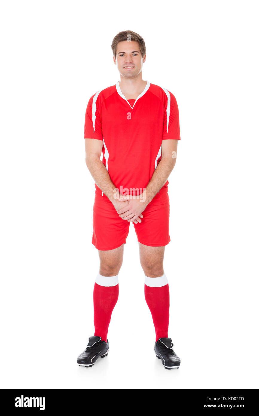 Porträt eines Fußballspielers stehend auf weißem Hintergrund Stockfoto
