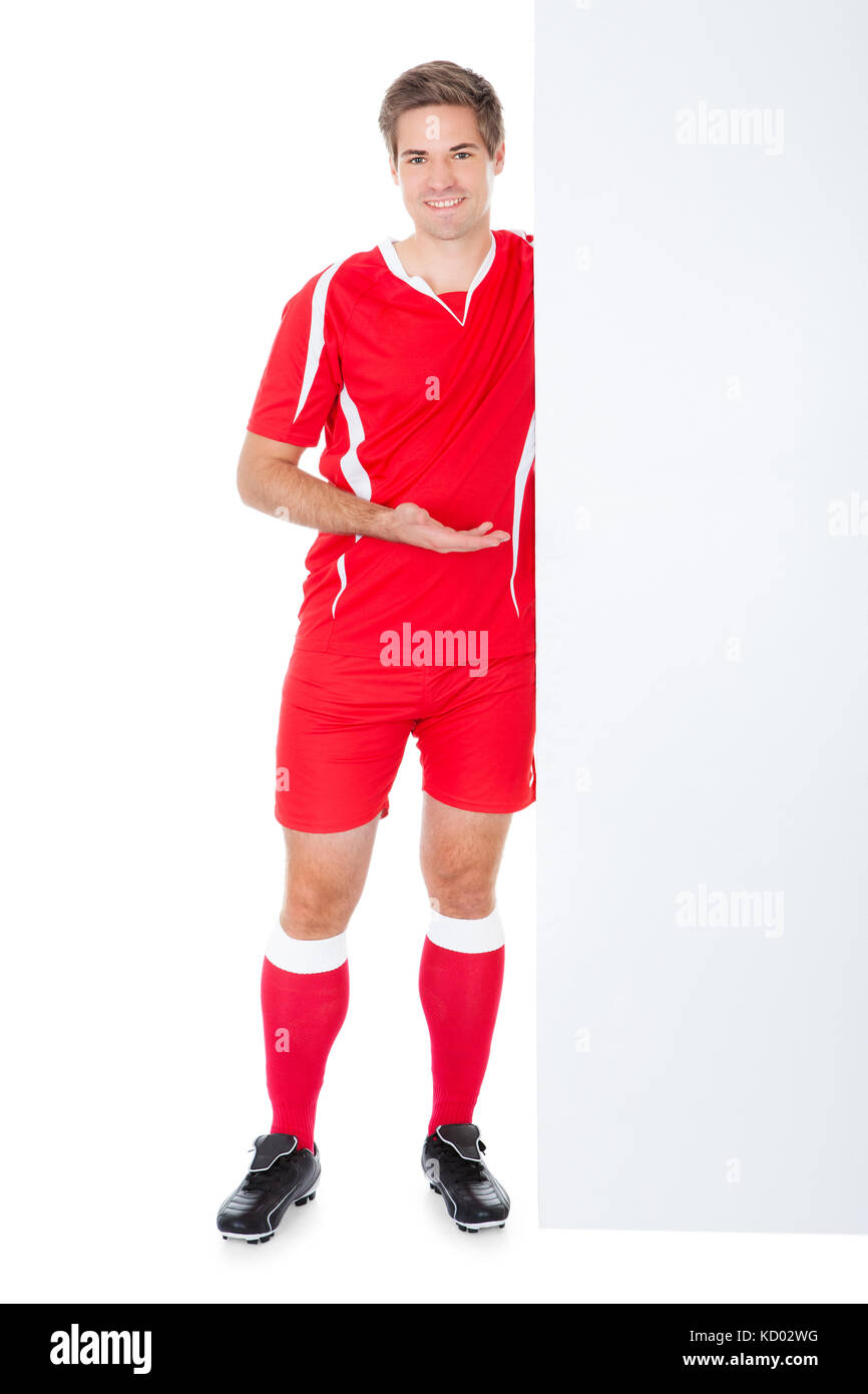 Porträt eines Fußballspielers präsentieren Plakat Stockfoto