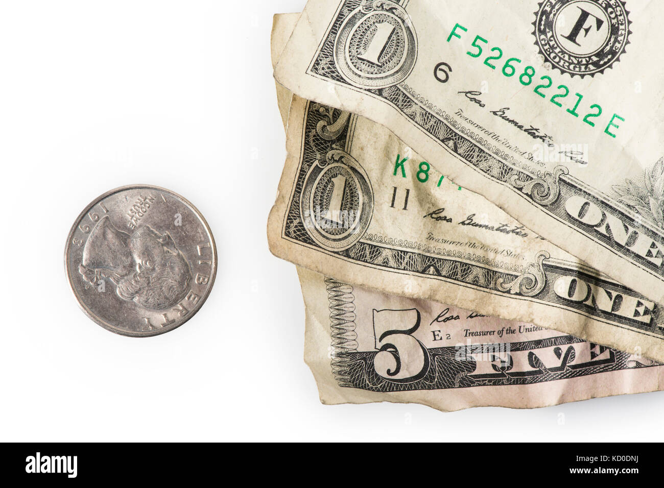 Faltige Dollarscheine und ein Viertel bis zu $7.25 hinzufügen, die aktuellen (Stand 2016) US Federal Mindestlohn. Stockfoto