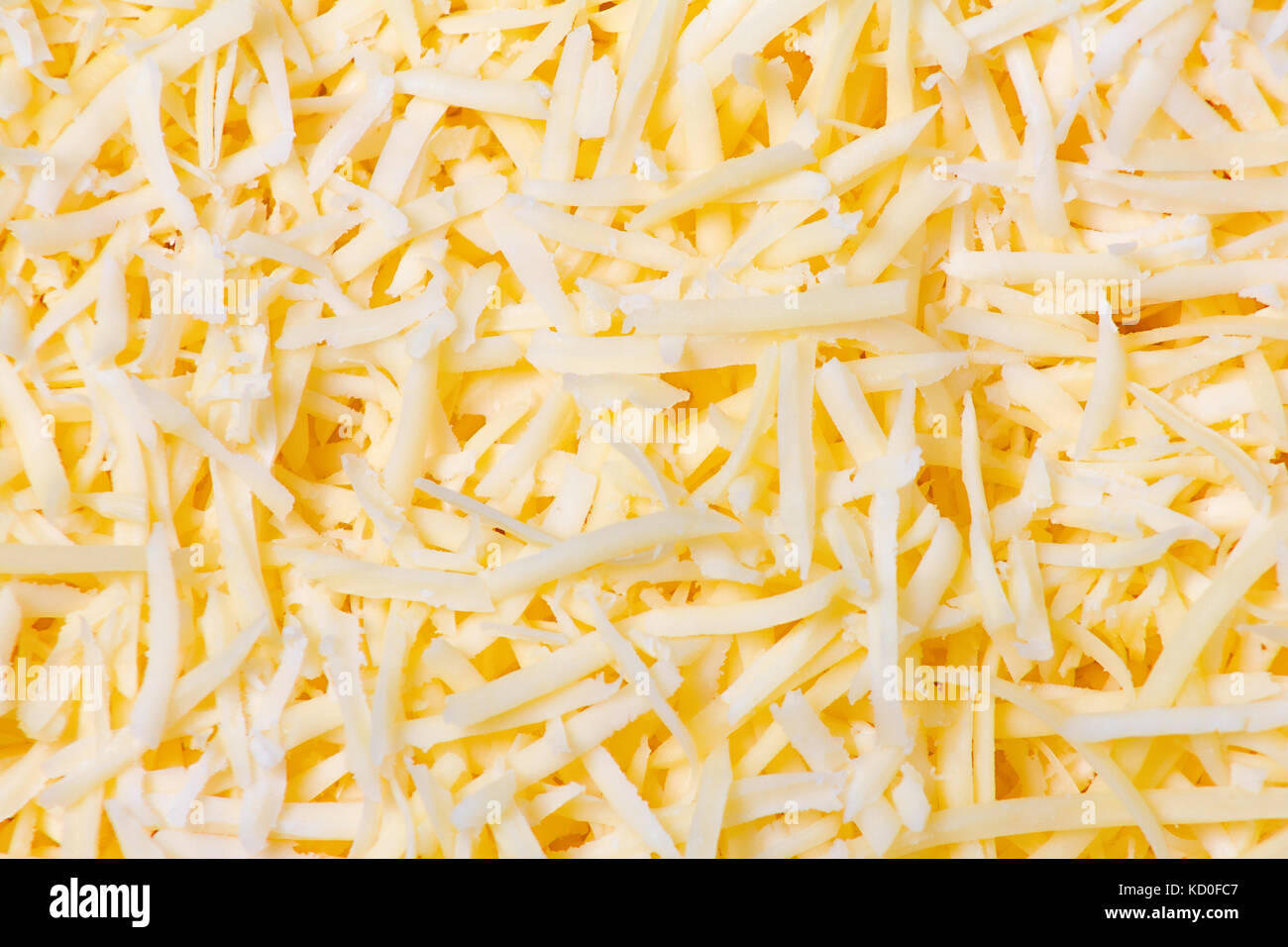 Geriebenen Käse Hintergrund. Nahaufnahme, Ansicht von oben. Stockfoto