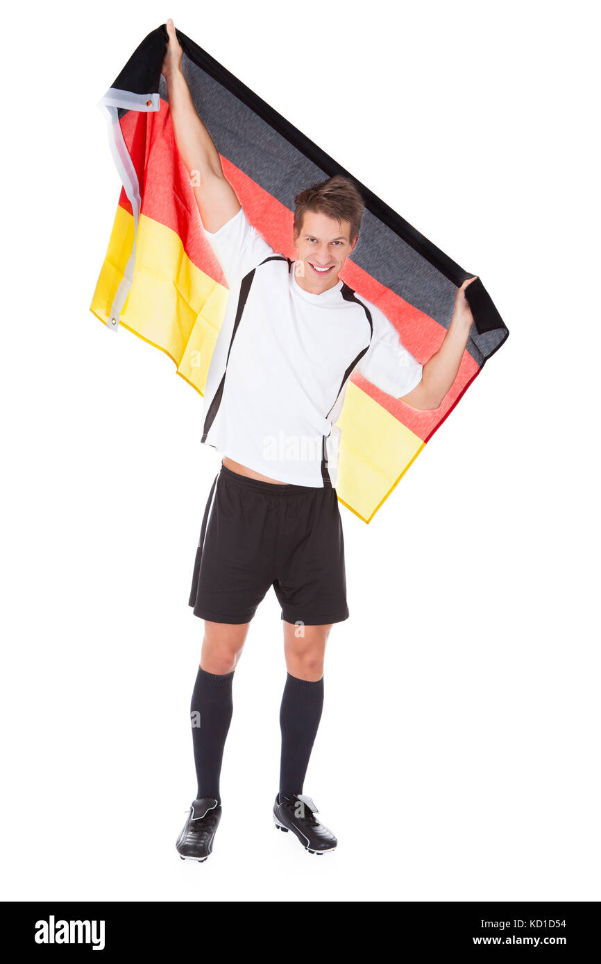 Porträt von männlichen deutschen Fußballspieler mit Fahne Stockfoto