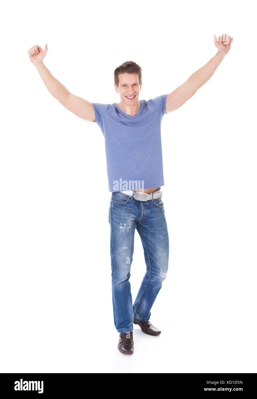 Porträt von aufgeregt, junger Mann mit Hand Over White Background Stockfoto