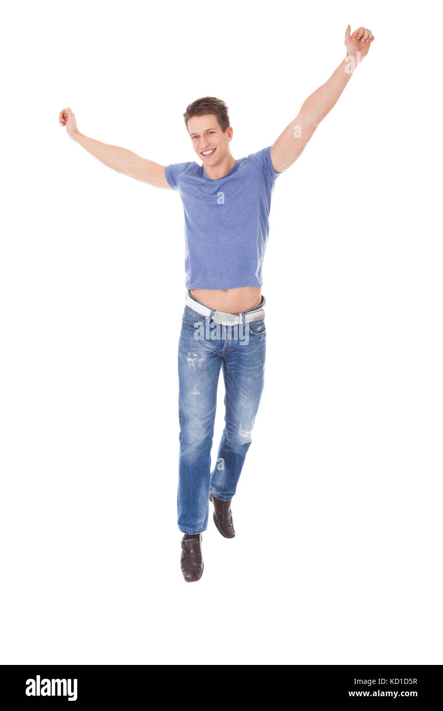 Porträt von aufgeregt, junger Mann mit Hand Over White Background Stockfoto