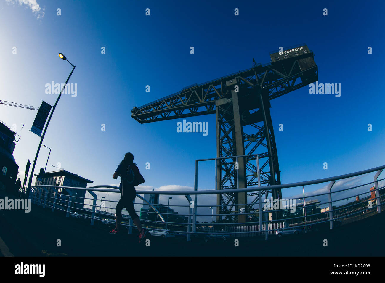 Jogger laufen über die finnieston Kran in Glasgow GROSSBRITANNIEN Stockfoto