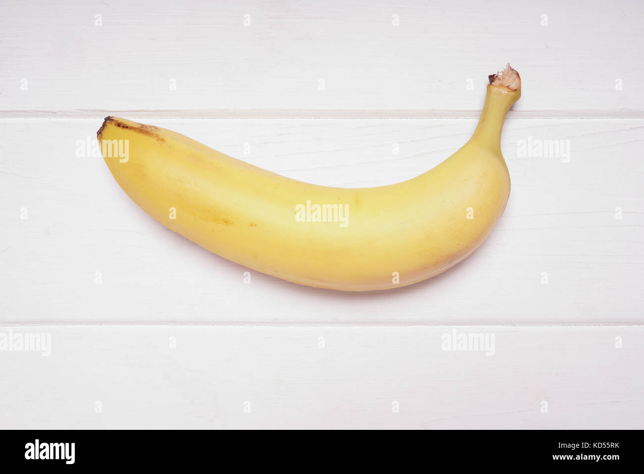 Banane auf weiße Holz- Hintergrund Stockfoto