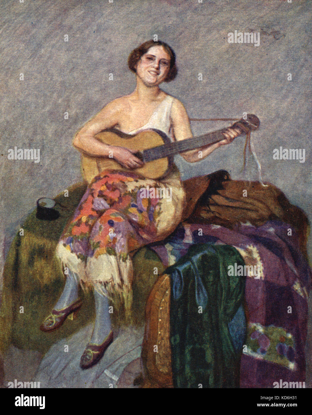 Junge Mädchen spielte Gitarre im spanischen Stil Kleidungsstücke. Stockfoto
