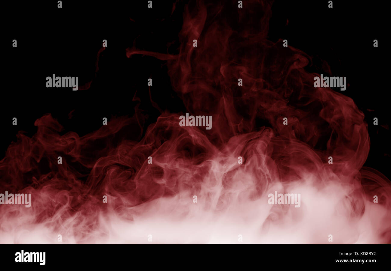 Red Smoke auf dem schwarzen Hintergrund. Stockfoto