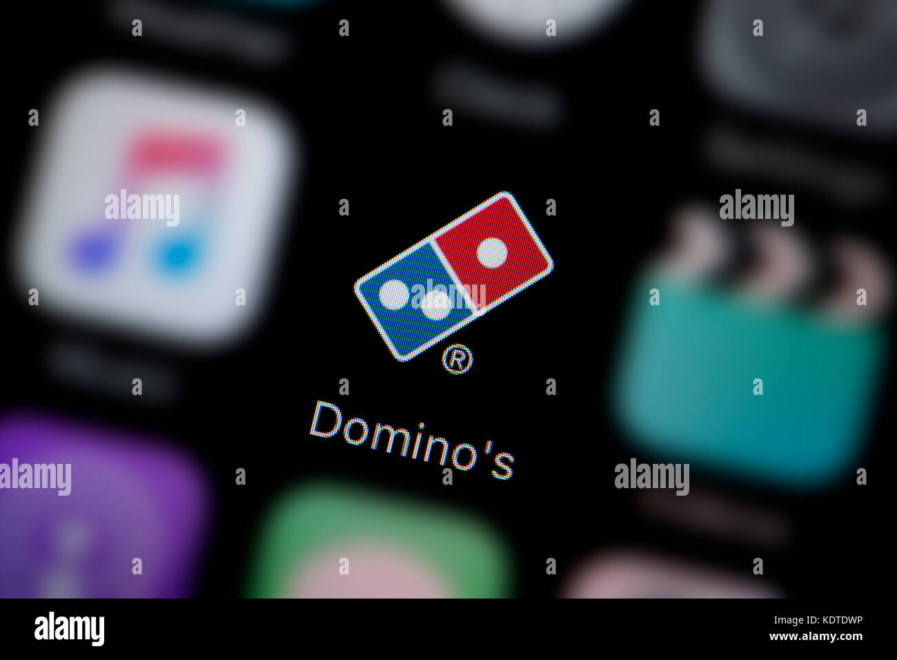 Eine Nahaufnahme des Logo für Pizza App das Symbol des Domino, wie auf dem Bildschirm eines Smartphones (nur redaktionelle Nutzung) Stockfoto