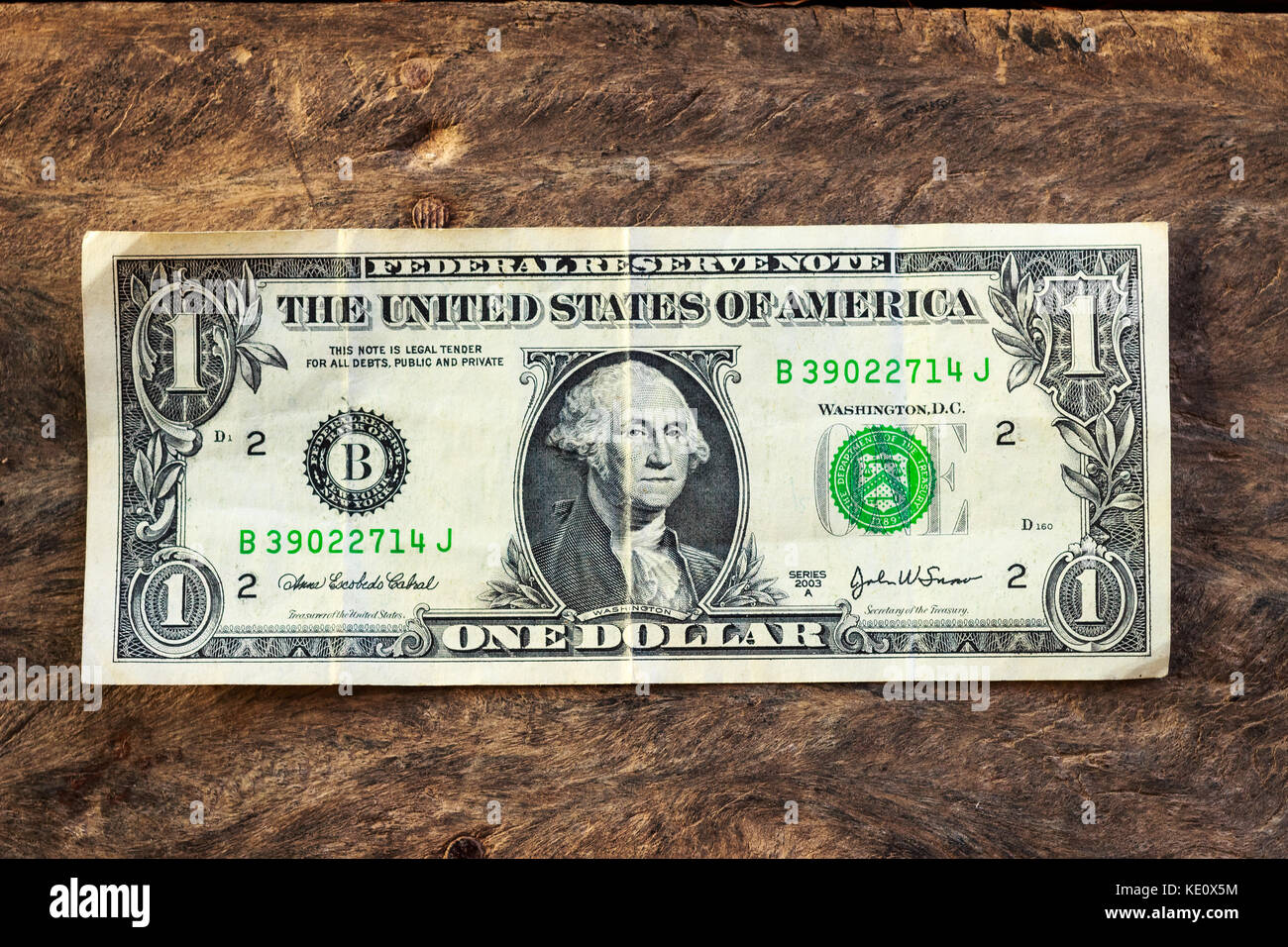 Alte dollar Bill auf grunge Holz Hintergrund Stockfoto