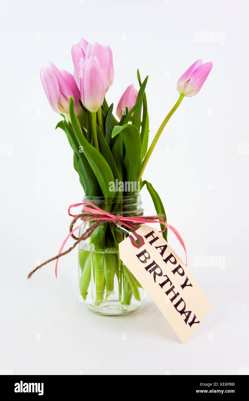 Happy birthday Tulpen in einem Glas Stockfoto