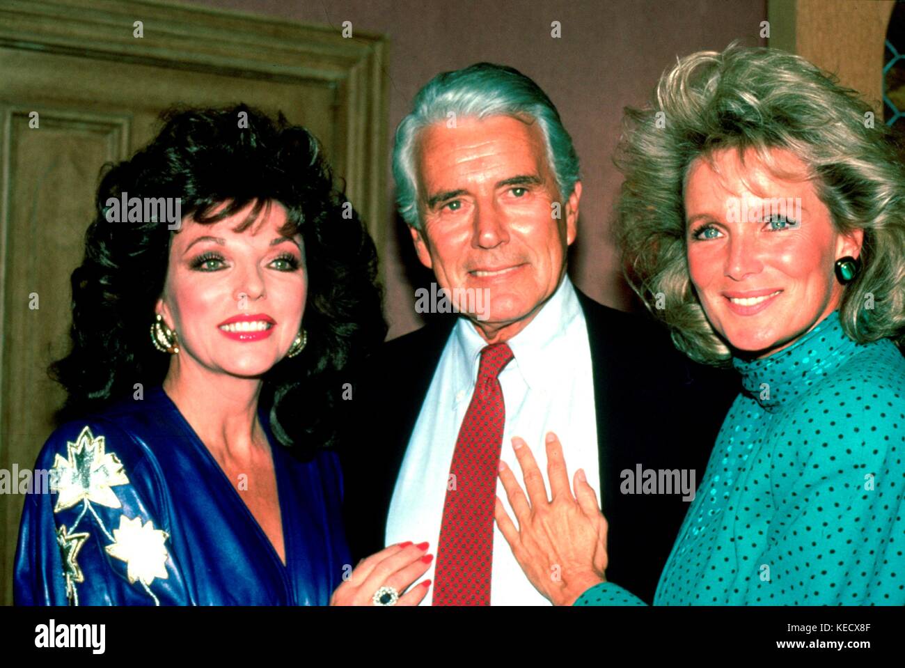 Joan Collins, John Forsythe und Linda Evans von der Fernsehsendung ' Dynasty ' fotografierten Mitte der 1980er Jahre. © RTTalesnick /MediaPunch. Gutschrift für alle Verwendungszwecke Stockfoto