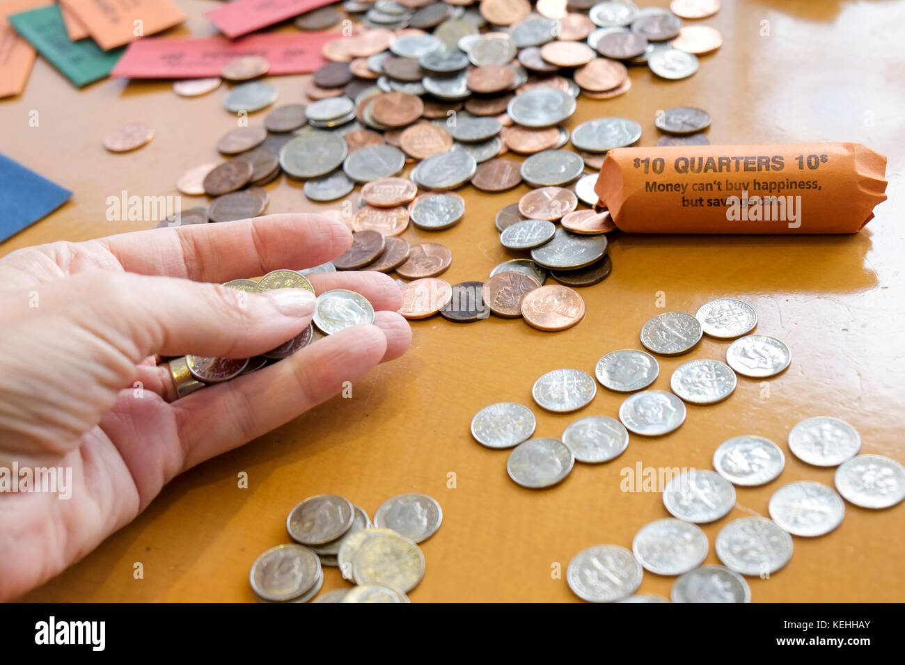 Hand mit Münzen Stockfoto